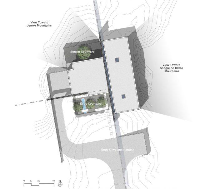 一層現(xiàn)代風格山間別墅，兩面混凝土墻壁打開整個建筑空間